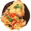 Arroz con Pollo on a bed of Mole